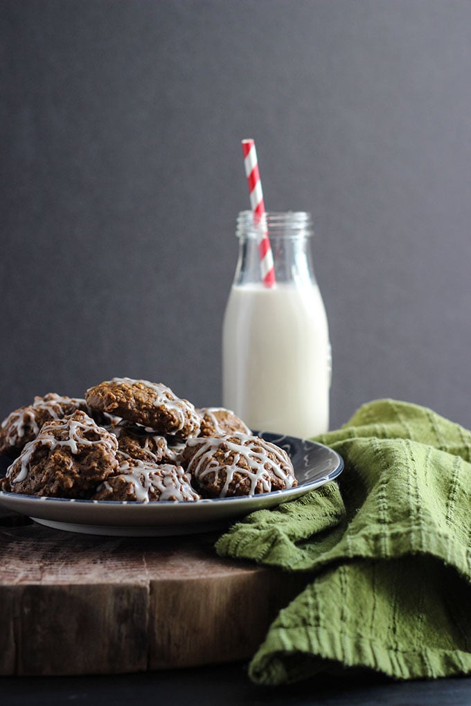 Pumpkin Molasses Cookies on a plate next to a jar of milk.
