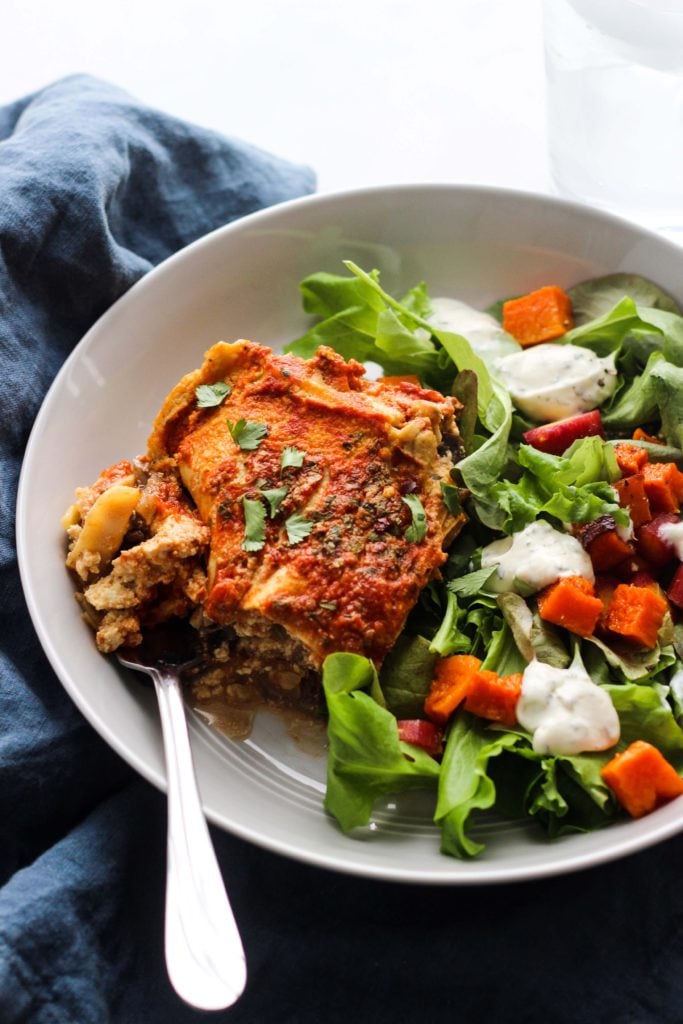 Vegan Spinach and Mushroom Lasagna on plate with salad