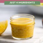 lemon dijon dressing in small glass mason jar.