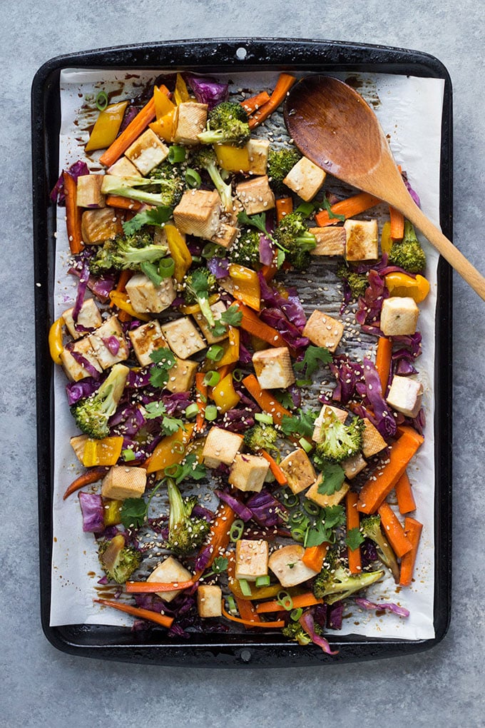 Teriyaki Tofu Sheet Pan Dinner on sheet pan with a wooden spoon.
