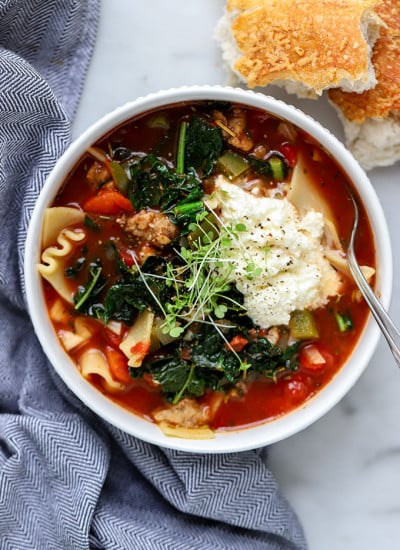 Vegetarian Lasagna Soup in white bowl with blue napkin