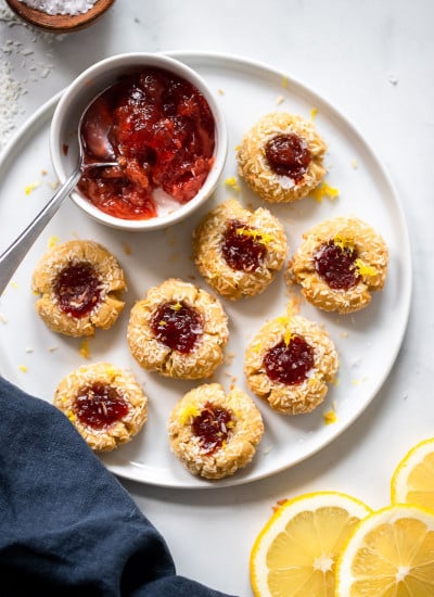 almond flour thumbprint cookies on white plate