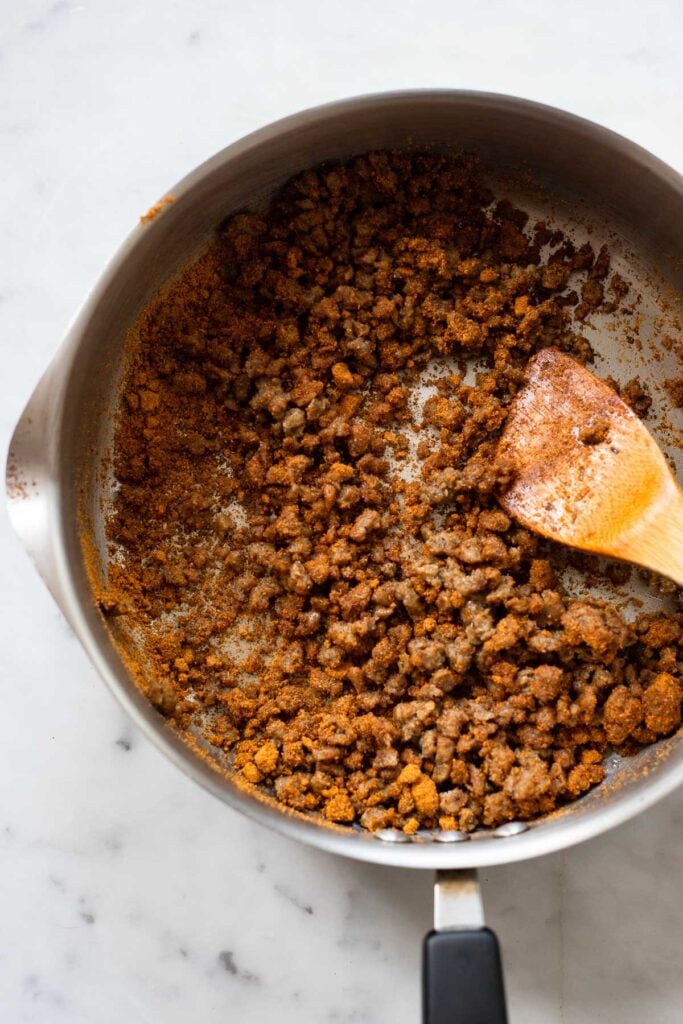 ground seitan in pan with taco seasoning.