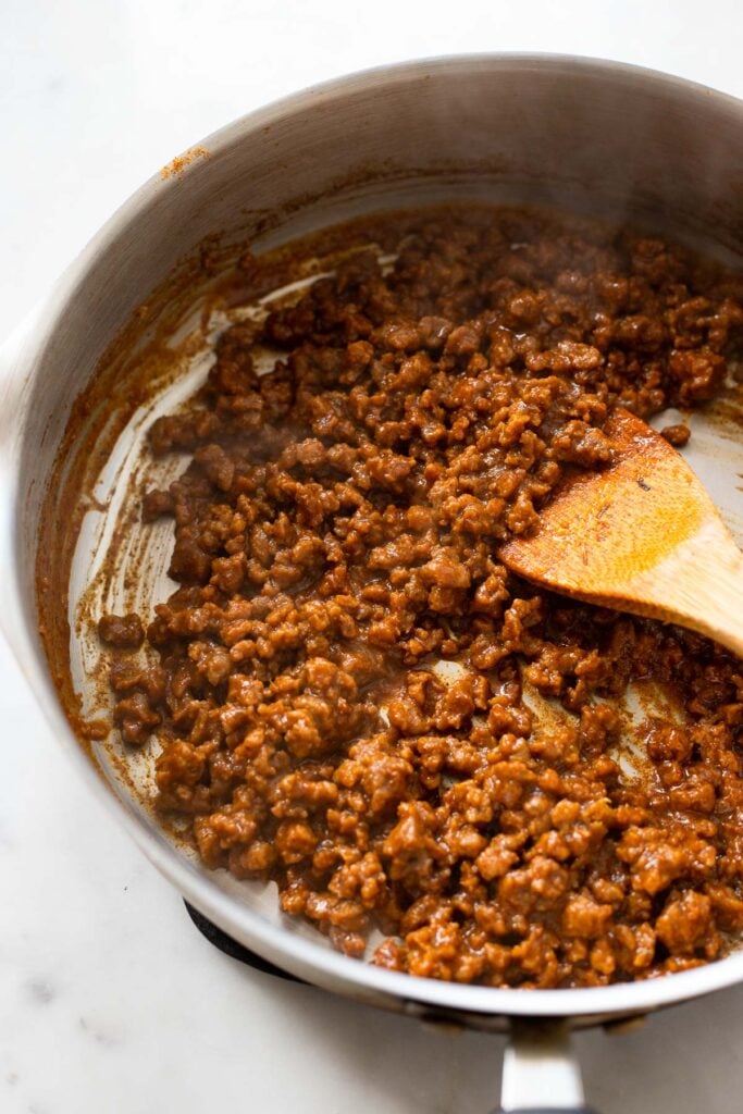 ground seitan in pan with sauce cooked until thickened.