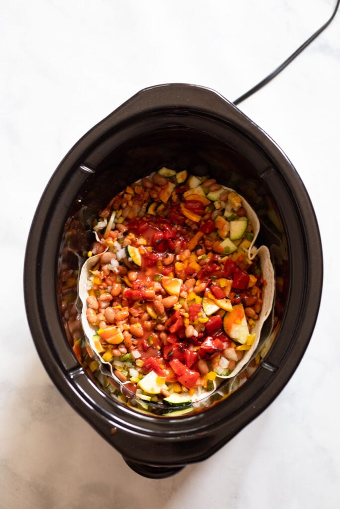 add tomato/enchilada sauce layer to crockpot