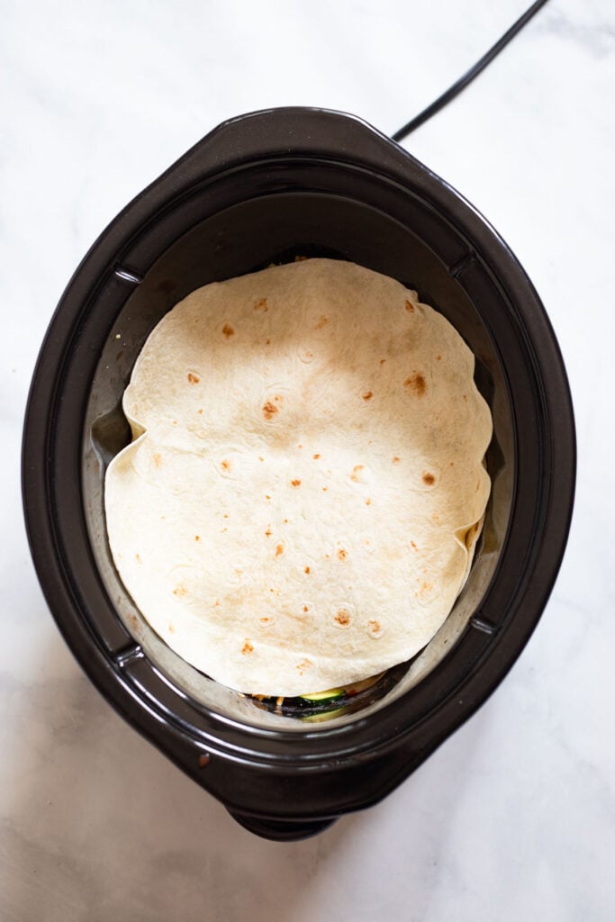 add tortilla layer to crockpot