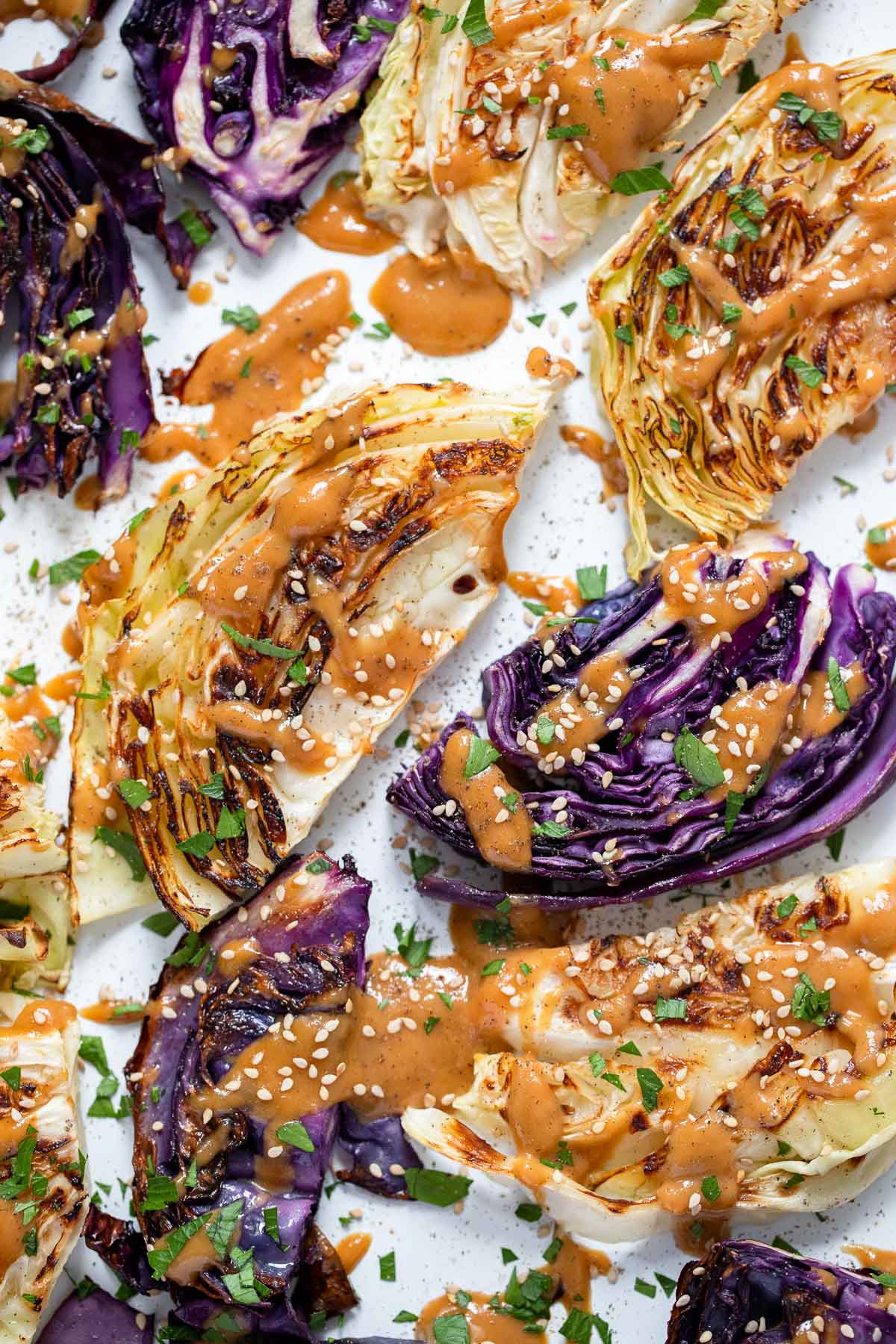 close up photo of cabbage and tahini sauce