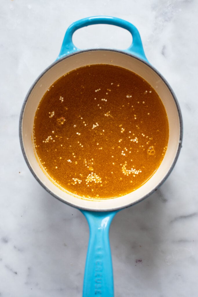 step 1 add broth, curry powder, and quinoa to a small saucepan.