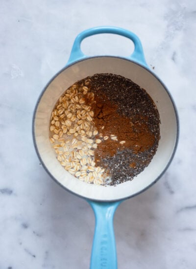chai spice oatmeal ingredients in a small saucepan before cooking.