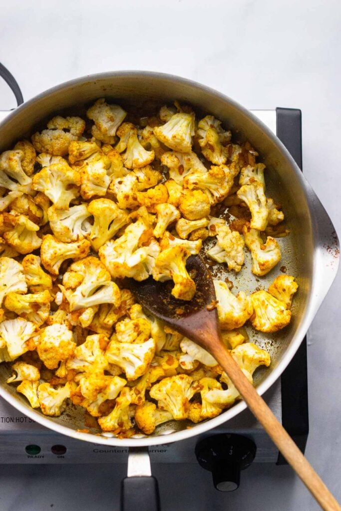 add cauliflower to the skillet.