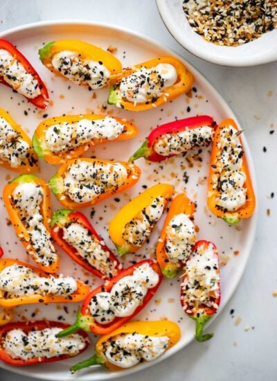 vegan cream cheese stuffed peppers on a white plate.