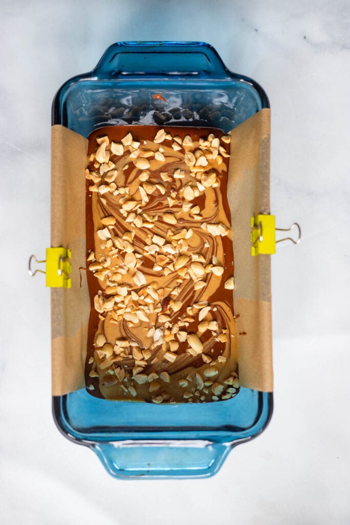fudge in pan garnished with chopped peanuts before chilling.