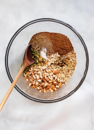 chocolate granola ingredients in mixing bowl before stirring.