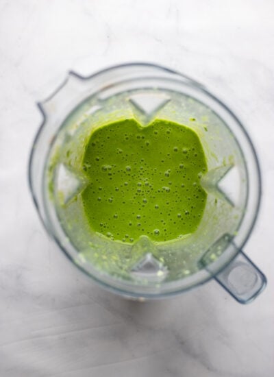 grapefruit green smoothie in blender pitcher. 