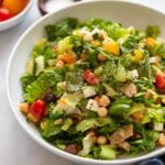 vegan Italian chopped salad in bowl with black pepper.