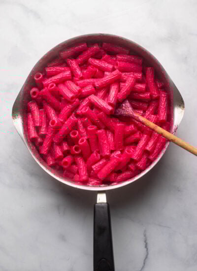 creamy beet pasta sauce tossed with rigatoni in a large skillet. 