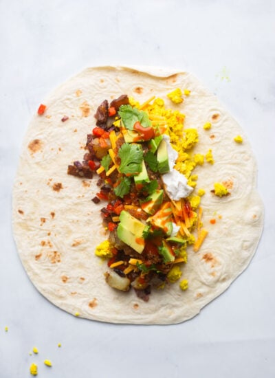 tortilla with burrito fillings before rolling. 