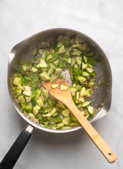 sautéed pepper, onion, and zucchini in a skillet. 
