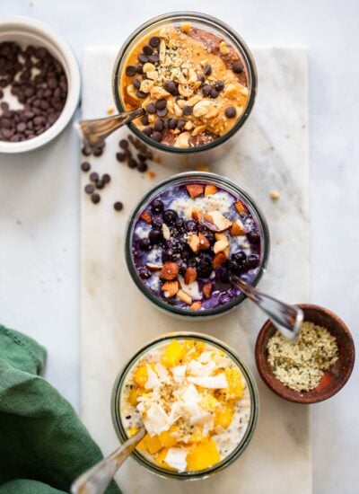 3 glass jars of overnight oats with different flavorings.