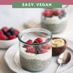 vanilla chia seed pudding in a jar topped with yogurt and fresh berries.