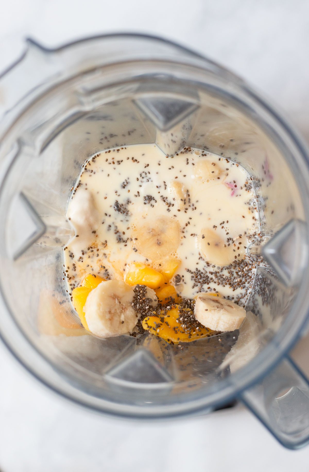 smoothie ingredients in the blender pitcher before blending. 