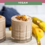 tahini smoothie with dates in a glass with granola.