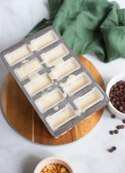 banana popsicle mixture poured into popsicle mold before freezing. 