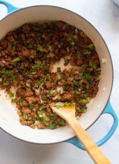 cooked onion, bell pepper, and vegan ground beef in a dutch oven.