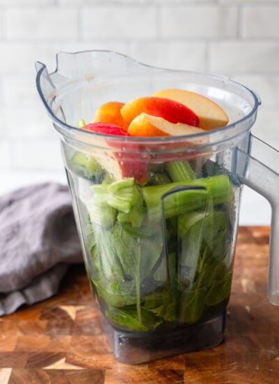green juice ingredients in the blender pitcher before blending.